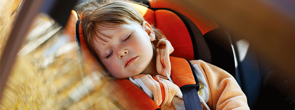 Child sleeping in a car seat